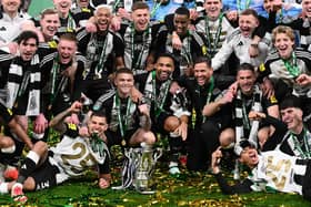 The Newcastle United squad following their historic Carabao Cup winning triumph over Liverpool.   (Photo by Stu Forster/Getty Images)