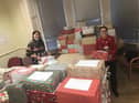Lauren Hunter and Emma Whitelock, ACTS staff members with last year's shoe boxes