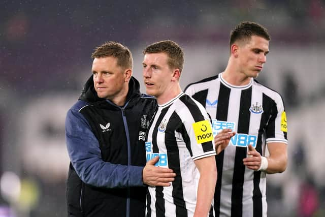 Newcastle United head coach Eddie Howe greets Matt Targett after the West Ham United win.