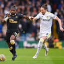 Allan Saint-Maximin of Newcastle United is challenged by Luke Ayling of Leeds United during the Premier League match between Leeds United and Newcastle United at Elland Road on January 22, 2022 in Leeds, England. (Photo by Stu Forster/Getty Images)