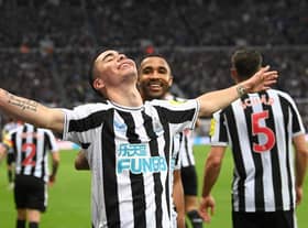 Goalscorer Miguel Almiron celebrates after scoring the fourth Newcastle goal with Callum Wilson during the Premier League match between Newcastle United and Aston Villa at St. James Park on October 29, 2022 in Newcastle upon Tyne, England. (Photo by Stu Forster/Getty Images)