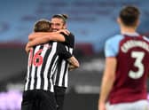 Jeff Hendrick, left, celebrates scoring Newcastle United's second goal with Andy Carroll.