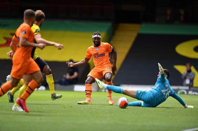 Newcastle United's French midfielder Allan Saint-Maximin (C) takes a shot but is off-side during the English Premier League football match between Watford and Newcastle at Vicarage Road Stadium in Watford, north of London on July 11, 2020.