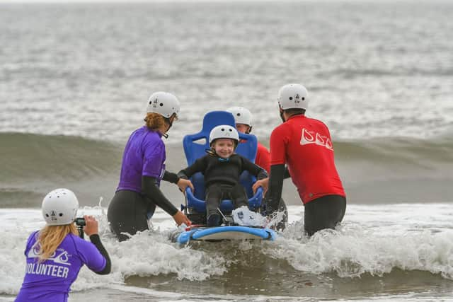 Children from St Oswald's Hospice, taking part in South Shields Surf CIC for their last session of the season on Thursday afternoon. Keira Moore on the adapted surf board