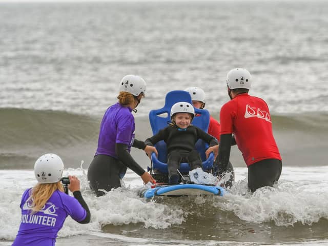 Children from St Oswald's Hospice, taking part in South Shields Surf CIC for their last session of the season on Thursday afternoon. Keira Moore on the adapted surf board