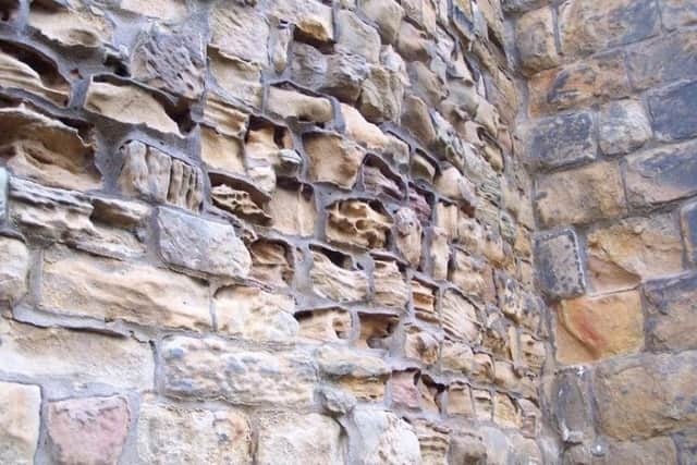 Eroded stonework at Alnwick Castle.