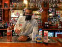 Manager Alex Ozobia at Hogarths, which is running a donation drop for a food bank, with kind-hearted customers taking part to receive a free gin and tonic for World Gin Day.
