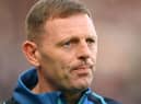 Graeme Jones looks on from the technical area.