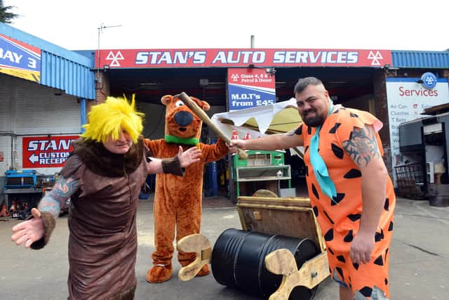 A Flintstones car made to cheer people up during the pandemic. Stan Yanetta as Barney Rubble, Gary Thorius as Fred Flintstone and Simon Lishman as 'Dino'.