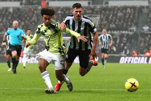 Tyler Adams of Leeds United challenges Fabian Schar of Newcastle United during the Premier League match between Newcastle United and Leeds United at St. James Park on December 31, 2022 in Newcastle upon Tyne, England. (Photo by George Wood/Getty Images)