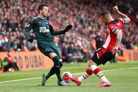 SOUTHAMPTON, ENGLAND - MARCH 07: Javier Manquillo of Newcastle United is tackled by Danny Ings of Southampton during the Premier League match between Southampton FC and Newcastle United at St Mary's Stadium on March 07, 2020 in Southampton, United Kingdom. (Photo by Jordan Mansfield/Getty Images)