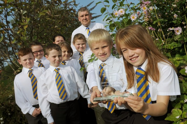 Dunn Street Primary School gardening club members were pictured with headteacher Stewart Reader and their Northumbria in Bloom award which they won 8 years ago.