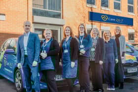 Some of the Care 24-7 Team with the new car fleet outside the Leeds office