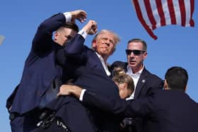 Republican presidential candidate former President Donald Trump is surround by US Secret Service agents at a campaign rally. PIC: AP Photo/Evan Vucci