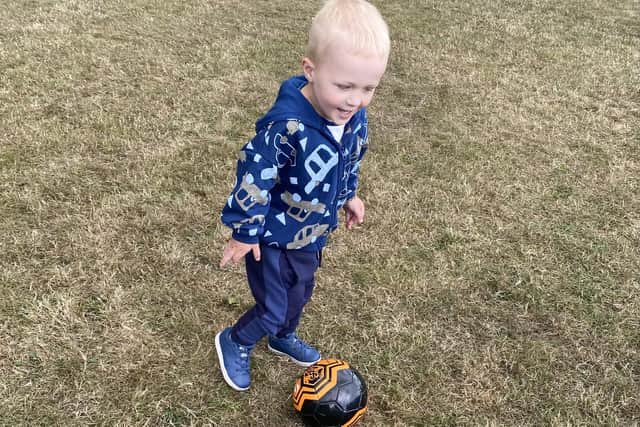 Elijah playing football