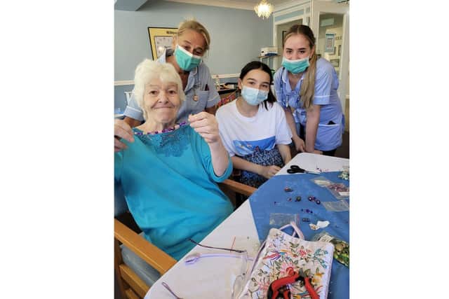 (from left) Willowdene Care Home resident Jen Black, 74, carer Andrea Bennet and (right) carer Rhiannon Jack making jewellery with a member of the Foundation of Light NCS.