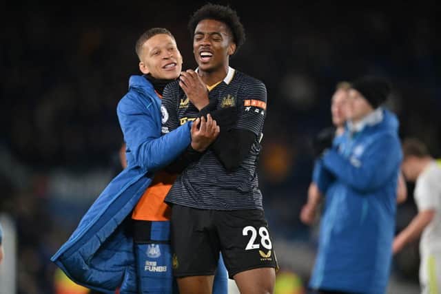 Newcastle United's English striker Dwight Gayle (L) and Newcastle United's English midfielder Joe Willock (R) celebrate on the pitch after during the English Premier League football match between Leeds United and Newcastle United at Elland Road in Leeds, northern England on January 22, 2022. (Photo by PAUL ELLIS/AFP via Getty Images)