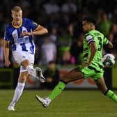 Jan Paul van Hecke of Brighton & Hove Albion passes the ball under pressure. (Photo by Alex Burstow/Getty Images).