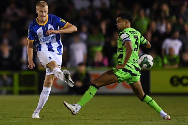 Jan Paul van Hecke of Brighton & Hove Albion passes the ball under pressure. (Photo by Alex Burstow/Getty Images).