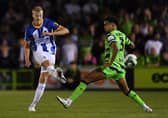 Jan Paul van Hecke of Brighton & Hove Albion passes the ball under pressure. (Photo by Alex Burstow/Getty Images).
