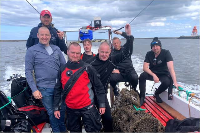 The team of volunteer divers out at sea