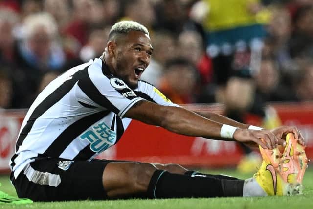 Newcastle United midfielder Joelinton stretches after a challenge.