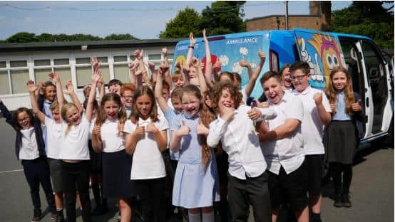 Schoolchildren helped design the ambulance's exterior decor