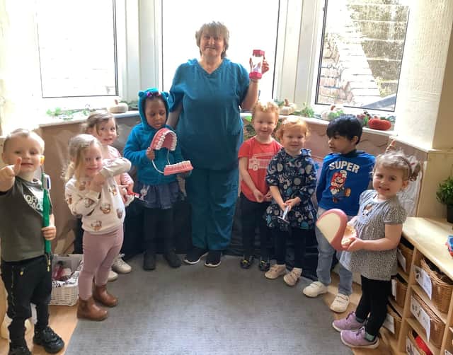 Carole Stephen from St Michael's Dental Practice visits children at Nurserytime South Shields.