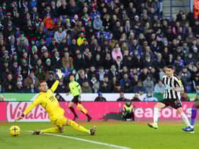 Miguel Almiron of Newcastle United scores the team's second goal past Danny Ward of Leicester City during the Premier League match between Leicester City and Newcastle United at The King Power Stadium on December 26, 2022 in Leicester, England. (Photo by Marc Atkins/Getty Images)