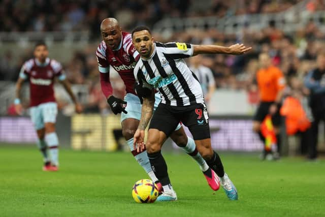 Callum Wilson of Newcastle United battles for possession with Angelo Ogbonna of West Ham United during the Premier League match between Newcastle United and West Ham United at St. James Park on February 04, 2023 in Newcastle upon Tyne, England. (Photo by Ian MacNicol/Getty Images)