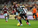 Callum Wilson of Newcastle United battles for possession with Angelo Ogbonna of West Ham United during the Premier League match between Newcastle United and West Ham United at St. James Park on February 04, 2023 in Newcastle upon Tyne, England. (Photo by Ian MacNicol/Getty Images)