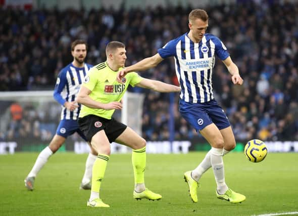 Dan Burn in action for Brighton and Hove Albion. (Photo by Bryn Lennon/Getty Images)