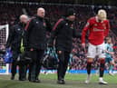 Manchester United's Alejandro Garnacho leaves the pitch with an injury.