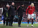 Manchester United's Alejandro Garnacho leaves the pitch with an injury.