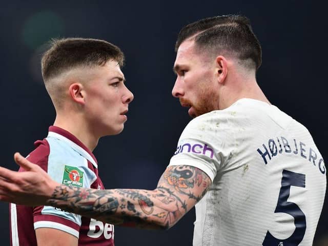 West Ham United's Scottish defender Harrison Ashby (L) clashes with Tottenham Hotspur's Danish midfielder Pierre-Emile Hojbjerg (R) during the English League Cup quarter-final football match between Tottenham Hotspur and West Ham United at Tottenham Hotspur Stadium in London, on December 22, 2021.(Photo by BEN STANSALL/AFP via Getty Images)