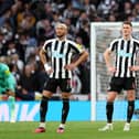 Joelinton (L and Sven Botman of Newcastle United look dejected after the Manchester United second goal during the Carabao Cup Final match between Manchester United and Newcastle United at Wembley Stadium on February 26, 2023 in London, England. (Photo by Julian Finney/Getty Images)