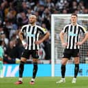 Joelinton (L and Sven Botman of Newcastle United look dejected after the Manchester United second goal during the Carabao Cup Final match between Manchester United and Newcastle United at Wembley Stadium on February 26, 2023 in London, England. (Photo by Julian Finney/Getty Images)