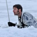 Guy Martin climbing out of a pit of ice cold water. He featured in a new series called Guy Martin: Arctic Warrior on Channel 4 (Picture: Royal Navy/Channel 4)