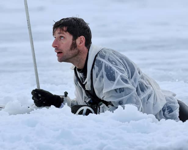 Guy Martin climbing out of a pit of ice cold water. He featured in a new series called Guy Martin: Arctic Warrior on Channel 4 (Picture: Royal Navy/Channel 4)