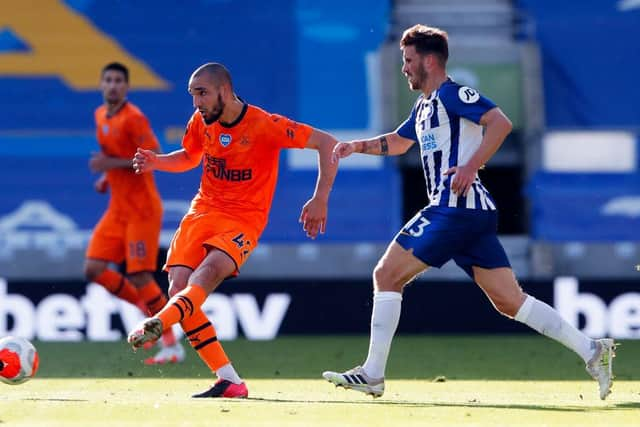 BRIGHTON, ENGLAND - JULY 20: Nabil Bentaleb of Newcastle United passes the ball under pressure from Pascal Gross of Brighton and Hove Albion during the Premier League match between Brighton & Hove Albion and Newcastle United at American Express Community Stadium on July 20, 2020 in Brighton, England. Football Stadiums around Europe remain empty due to the Coronavirus Pandemic as Government social distancing laws prohibit fans inside venues resulting in all fixtures being played behind closed doors. (Photo by Andrew Couldridge/Pool via Getty Images)