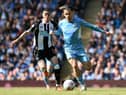 Newcastle United's Paraguayan midfielder Miguel Almiron (L) vies with Manchester City's English midfielder Jack Grealish during the English Premier League football match between Manchester City and Newcastle United at the Etihad Stadium in Manchester, north west England, on May 8, 2022 (Photo by PAUL ELLIS/AFP via Getty Images)