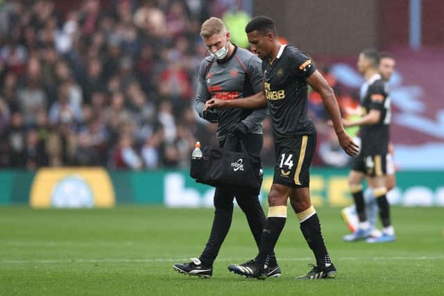 Isaac Hayden of Newcastle United receives medical treatment during the Premier League match between Aston Villa and Newcastle United at Villa Park on August 21, 2021 in Birmingham, England. (Photo by Ryan Pierse/Getty Images)