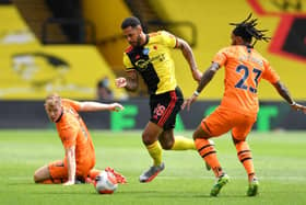WATFORD, ENGLAND - JULY 11: Andre Gray of Watford takes on Valentino Lazaro of Newcastle United during the Premier League match between Watford FC and Newcastle United at Vicarage Road on July 11, 2020 in Watford, England. (Photo by Justin Setterfield/Getty Images)