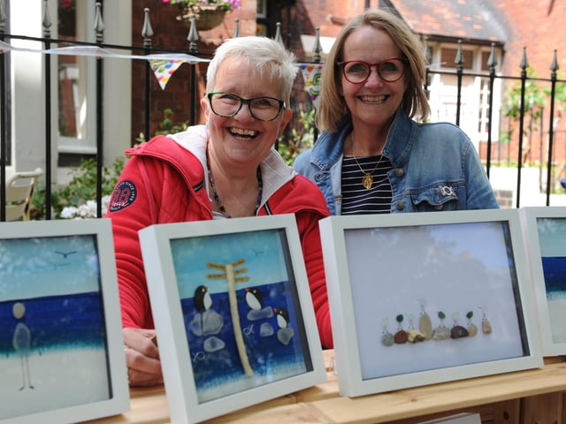 Caroline Corkin and Catherine Wells show off some artistic creations.