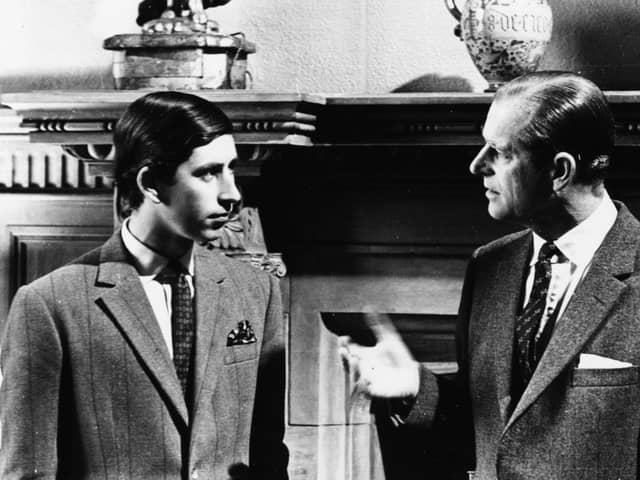 Prince Charles talking to his father, the Duke of Edinburgh, in front of a fireplace at Sandringham, Scotland, 1969. Picture: Central Press/Hulton Archive/Getty Images.