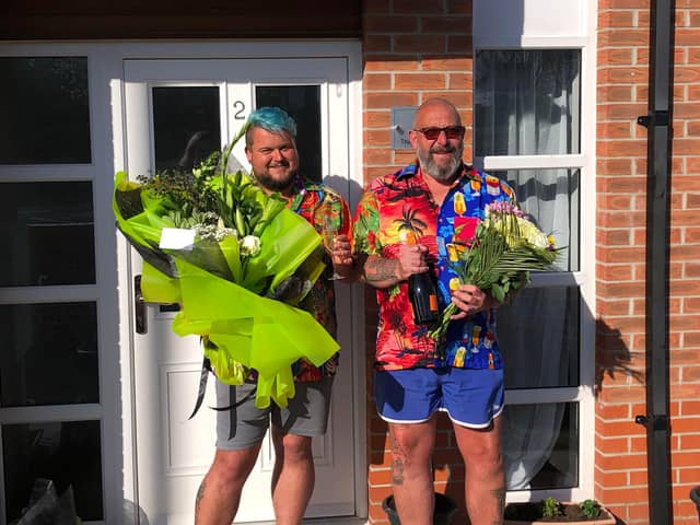 James Johnson, left, with Stew Fox with the gifts from Morrisons staff on what should have been their wedding day.