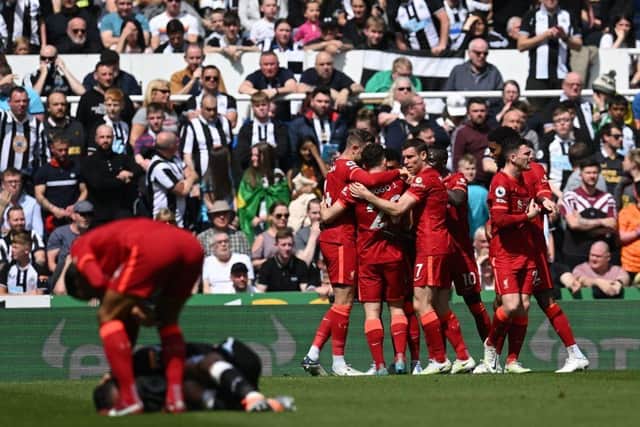 Liverpool celebrate scoring against Newcastle United (Photo by PAUL ELLIS/AFP via Getty Images)