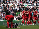 Liverpool celebrate scoring against Newcastle United (Photo by PAUL ELLIS/AFP via Getty Images)