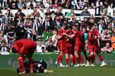 Liverpool celebrate scoring against Newcastle United (Photo by PAUL ELLIS/AFP via Getty Images)