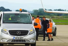 Actor Tom Cruise is greeted after touching down at Teesside International Airport.